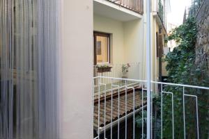 an external view of a building with a balcony at SARA GUEST HOUSE TAORMINA in Taormina