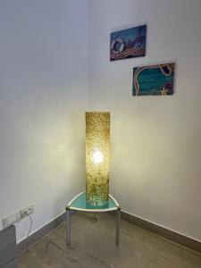 a lamp sitting on a table in a room at VISTAMARE apartments Reggio Calabria in Reggio di Calabria