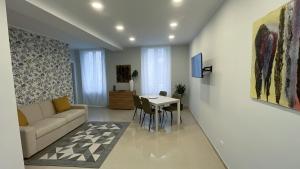 a living room with a couch and a table at MATT59 APARTMENTS in Rho