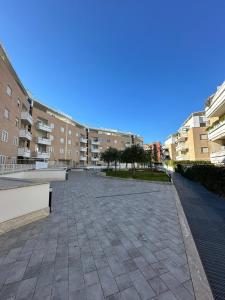 an empty courtyard in a building with buildings at Hygge Studio in Rome +30 photos