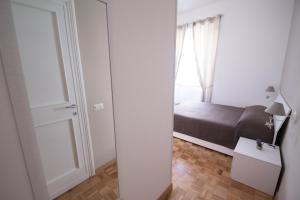 Postel nebo postele na pokoji v ubytování Vantaggio Apartment