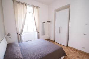 Postel nebo postele na pokoji v ubytování Vantaggio Apartment