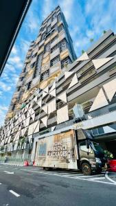 a truck parked in front of a large building at Arte Cheras by BlueBanana, Kuala Lumpur in Kuala Lumpur