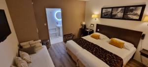 Postel nebo postele na pokoji v ubytování Hotel le Bellevue