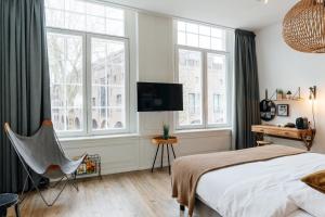 TV a/nebo společenská místnost v ubytování Eye Hotel