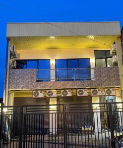 a house with a balcony with speakers on it at Calo apartel in Panabo