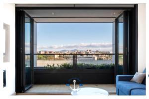 a living room with a view of the city at Eurosky Nine View in Rome