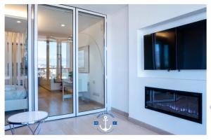a living room with a fireplace and a tv at Eurosky Nine View in Rome