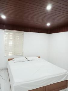 Ένα ή περισσότερα κρεβάτια σε δωμάτιο στο PETERCOTTAGE HOMESTAY