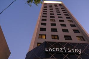 a tall building with the logo of la croixstay at LACOZi STAY , Seoul in Seoul