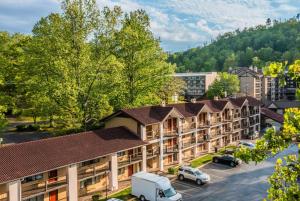 an aerial view of a hotel with a parking lot at Super 8 by Wyndham Downtown Gatlinburg at Convention Center in Gatlinburg