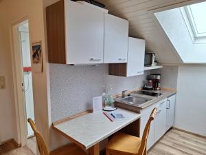 Kuchyň nebo kuchyňský kout v ubytování Gästehaus Schachnerhöhe