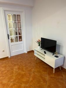TV a/nebo společenská místnost v ubytování Apartamento playa da Ribeira