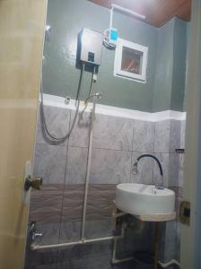 a small bathroom with a shower and a sink at Couple room blue RODEWAY HOUSE SPACE RENTAL in Pico