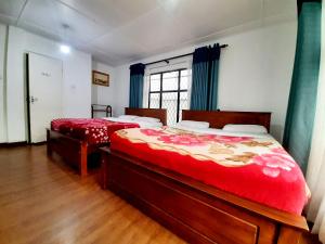 Postel nebo postele na pokoji v ubytování Sapu's Mountain breeze Nuwara Eliya