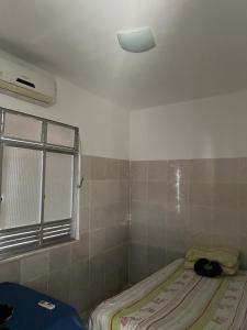 Ένα ή περισσότερα κρεβάτια σε δωμάτιο στο Casa 13 de Julho