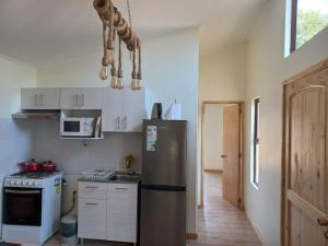 Køkken eller tekøkken på Cabaña en La Laguna