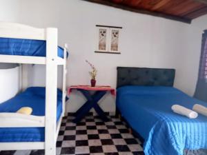 a bedroom with two bunk beds and a table at Mí Santa Guadalupe Esquina ctes in Esquina