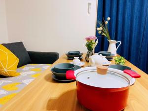 Uma área de estar em 無料駐車場 3階建て一軒家 最大10人 3寝室 2トイレ ペットOK家族団体向き Usj 道頓堀 難波近い