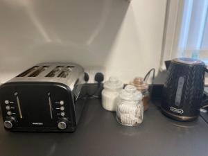 a toaster sitting on top of a kitchen counter at Dinorwic Lodge in Liverpool