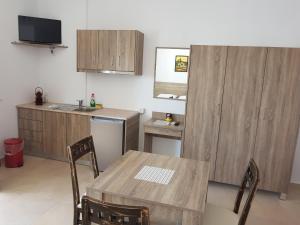 a kitchen with a table and a sink and a counter at Villa Stephania in Spílion