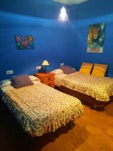 Postel nebo postele na pokoji v ubytování Casa Cotis Beceite