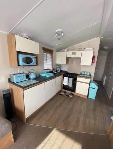 an overhead view of a kitchen in a tiny house at LottieLou’s Hot Tub breaks at Tattershall Lakes in Lincoln