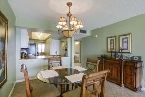 a dining room and kitchen with a table and chairs at Land's End 9-204 Beach Front in St. Pete Beach