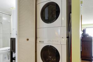 two washers and a dryer in a room at Land's End 9-204 Beach Front in St Pete Beach