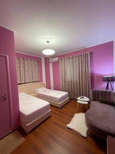 מיטה או מיטות בחדר ב-Bora Hotel