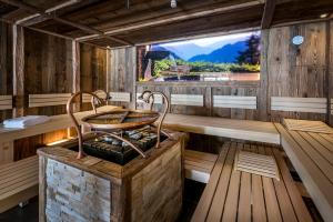 a sauna with a table on top of a stove at almlust - hotel, apartments, chalets in Flachau