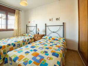 A bed or beds in a room at Apartment in Palomares near the Beach