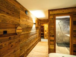 a wooden wall in a room with a bathroom at Chalet haut de gamme Bolquère * L'échappée Belle * in Bolquere Pyrenees 2000