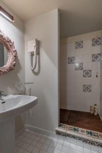 a bathroom with a sink and a shower at Old Bridge large and unique artful apartment with elevator in Florence +37 photos