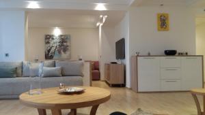a living room with a couch and a table at Bright 2 Bedroom House with Great Front View, Casablanca in Casablanca