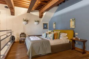 a bedroom with a bed in a room at Old Bridge large and unique artful apartment with elevator in Florence