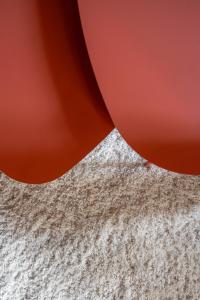 a close up of two red objects at Old Bridge large and unique artful apartment with elevator in Florence