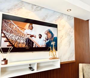 a flat screen tv on a wall in a living room at Tranquil Haven in Cape Town