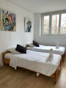 Кровать или кровати в номере Paisible appartement proche Paris Orly RER B à 5 minutes