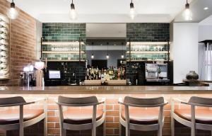 a bar in a restaurant with stools at Tranquil Haven in Cape Town