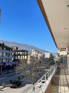 a view of a city from the balcony of a building at Bora Hotel in Gjirokastër