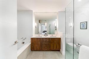 a bathroom with a sink and a mirror at Ocean View Residence 501 located at The Ritz-Carlton in Upper Land