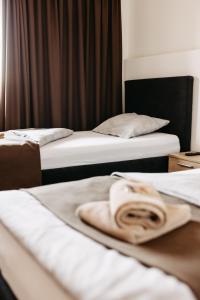 Ліжко або ліжка в номері Hotel Murat