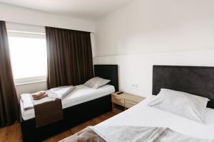 Ліжко або ліжка в номері Hotel Murat