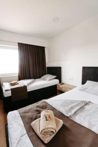 Ліжко або ліжка в номері Hotel Murat