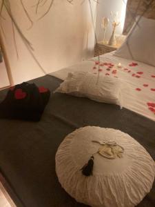 a bedroom with two beds with red hearts on it at Au coeur du 11 in Beyne-Heusay