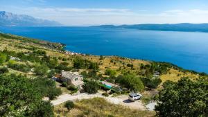 an aerial view of a large body of water at Dalmatian stone villa with pool in Lokva Rogoznica