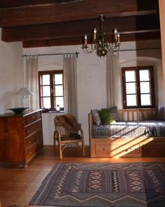 a living room with a couch and a chair at Vejminek Hynčina 