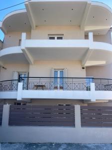 a view of a building with a balcony at Bright apartment, spacious near the center in Tríkala