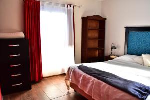 En eller flere senge i et værelse på Casita Azul